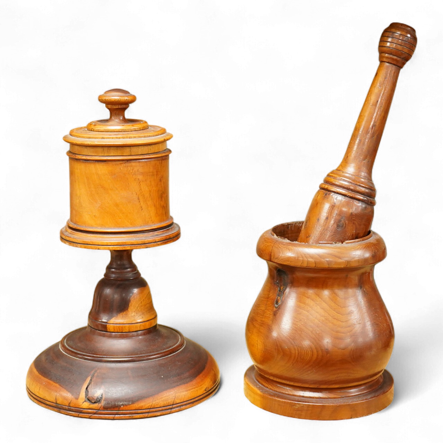 A 19th century treen lignum vitae pestle and mortar and turned cup and cover on stand- 25cm high